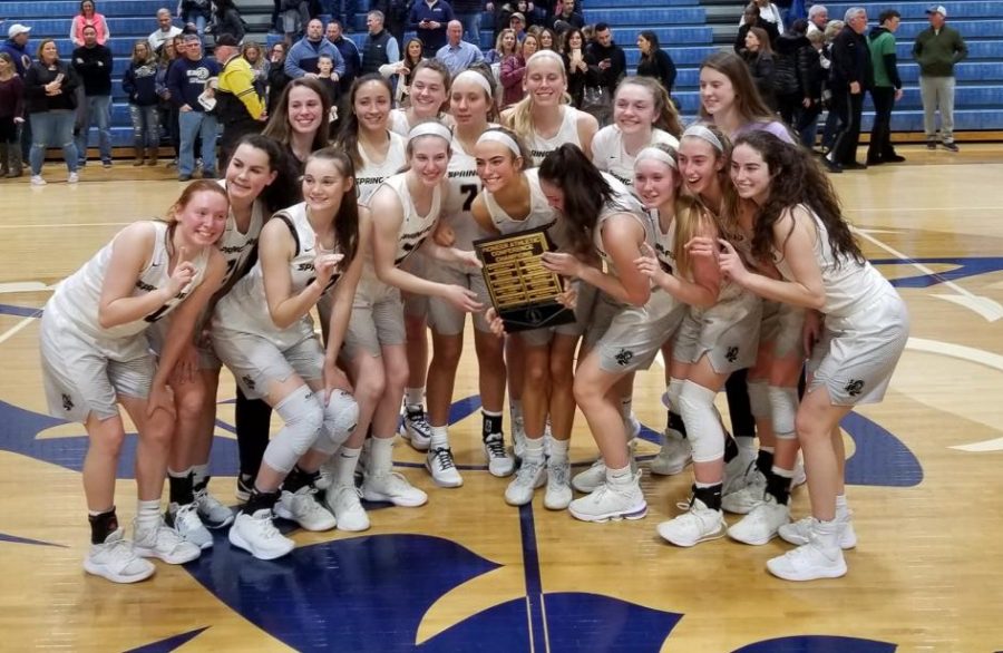 The+girls+basketball+team+celebrates+their+victory+over+Methacton+in+the+Pioneer+Athletic+Conference+Girls+Basketball+championship+game.+