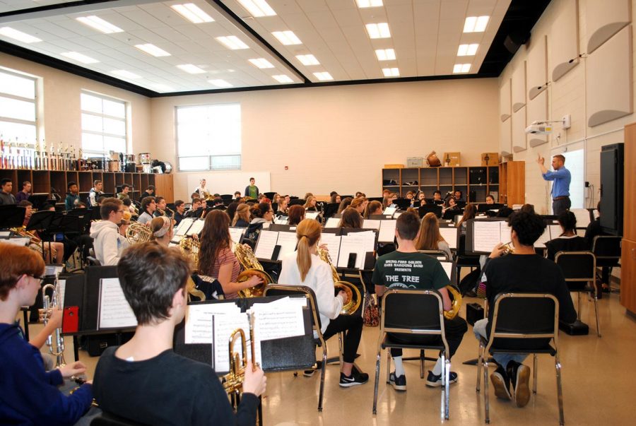 Spring-Ford music student rehearse during the school day with director Seth Jones (right).