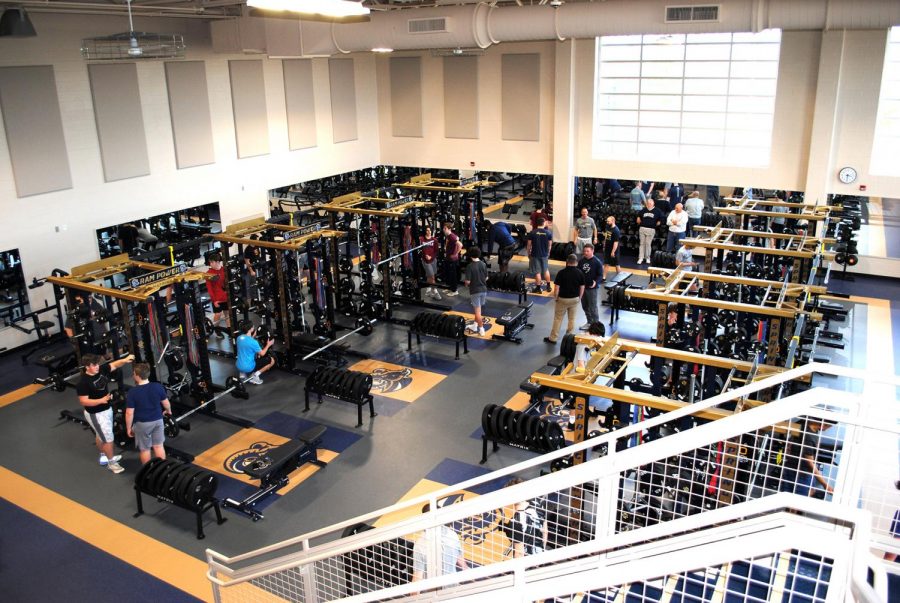 Students utilize the expanded weight room.