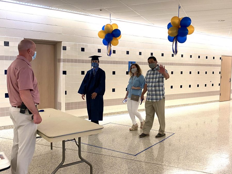 House Principal Dr. Robert Colyer greets a Spring-Ford senior and his family as they arrive for the students personal ceremonial graduation walk on Wednesday, May 27. RCTV filmed the walks and will piece them together with student and faculty speeches for a graduation production set to air June 12. If Covid-19 restrictions are lifted, a more traditional ceremony will be held later this summer. 