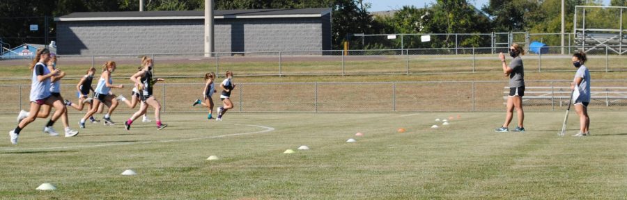 The field hockey team works through running drills prior to practice Sept. 23.