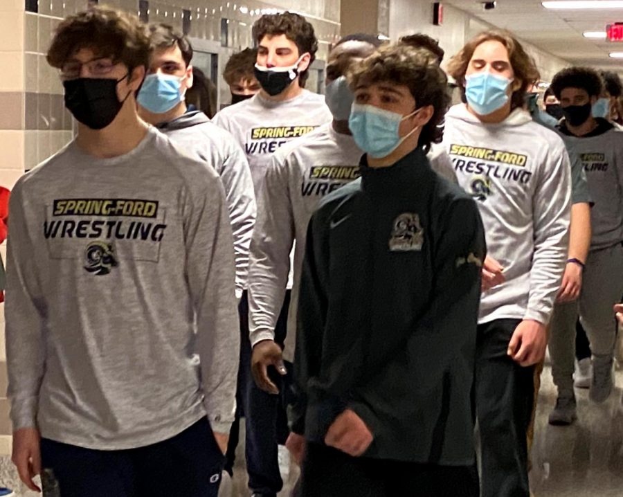 Senior wrestlers Jack McGill (left) and Gus Carfagno (right) lead the way as the wrestling team is greeted by classmates before departing for this weekends PIAA Class AAA Semifinal match. 