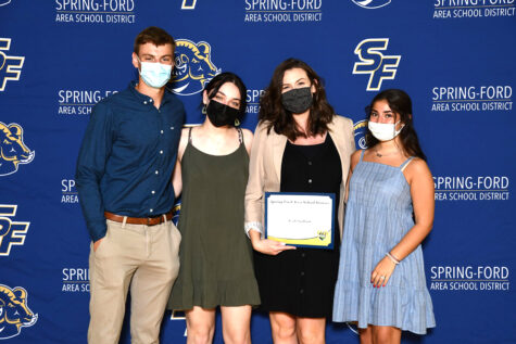 Teacher Leah Stallard is joined by students at the Impact Awards ceremony. The event allows seniors to honor an individual who impacted them during their Spring-Ford career. 