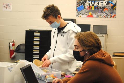 Stephen Voight (left) and John Kolesa work on a project in the Media Center’s Maker Space on Nov. 30. Students are 
experiencing a more traditional school year after a year-and-a-half of remote/hybrid learning. 