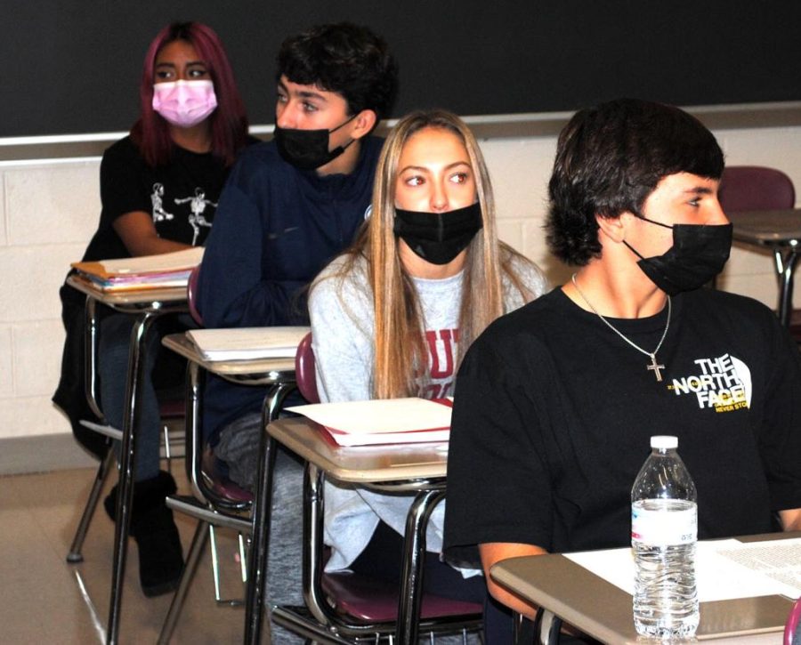 Spring-Ford juniors (from left) Vanesa Calvario, Chris deHaan, Lily Smith and Luca Carboy get ready for class Nov. 30. Students have been required to wear face masks to help prevent the spread of COVID-19 by order of Gov. Tom Wolf.  

