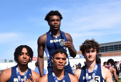 The Spring-Ford 4x400 relay team of (from left) Mason Scott, Chris Brittingham, Justin Johnson, and Jack Stanick stand by the medal podium after finishing second overall in the state in the event. 