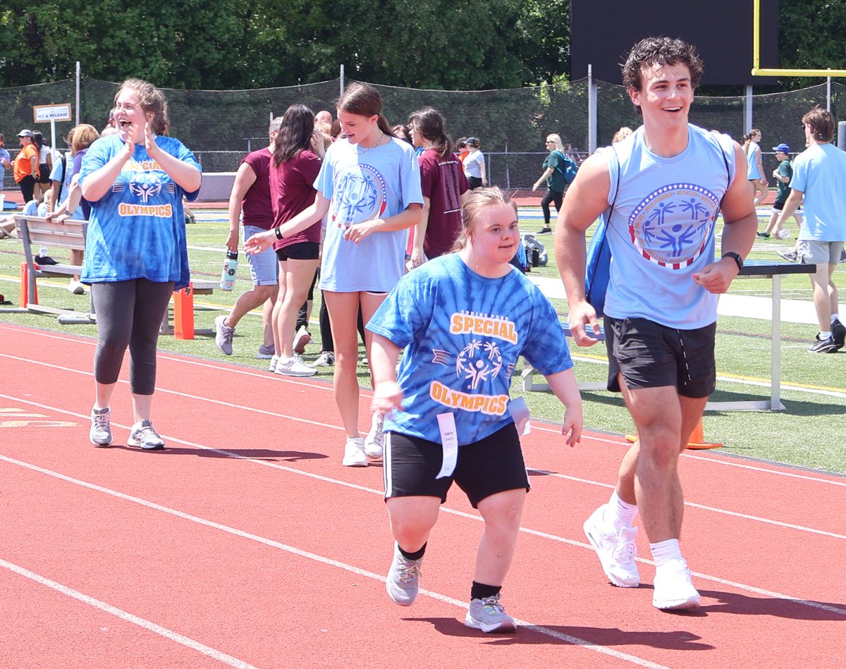 
Spring-Ford’s Special Olympics athletes Jillian Bonsall (far left) and Katelin Boorse (second from right) compete at May 1. 
Volunteer Brady Sharpe (far right) assists in the .50-meter dash. 