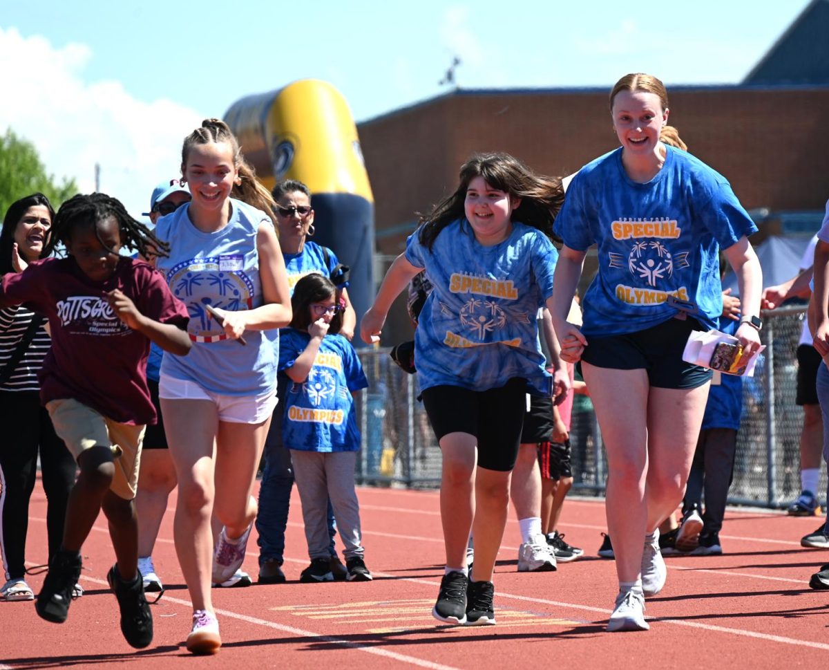 Spring-Ford students help athletes during a Special Olympics Track and Field event. Photo courtesy of Spring-Ford.
