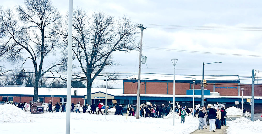 Spring-Ford students gather to protest ICE outside of the high school by Lewis Road on Feb. 11. Approximately 150 students from grades 8-12 walked out of their respective buildings for the peaceful protest. Charlotte King / Staff Photo
